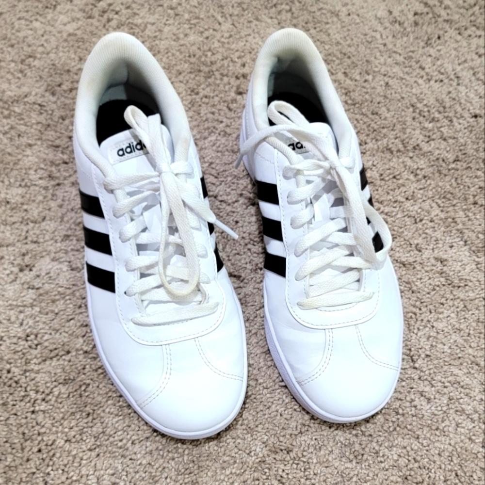 Adidas Size 6Y white with black stripes.